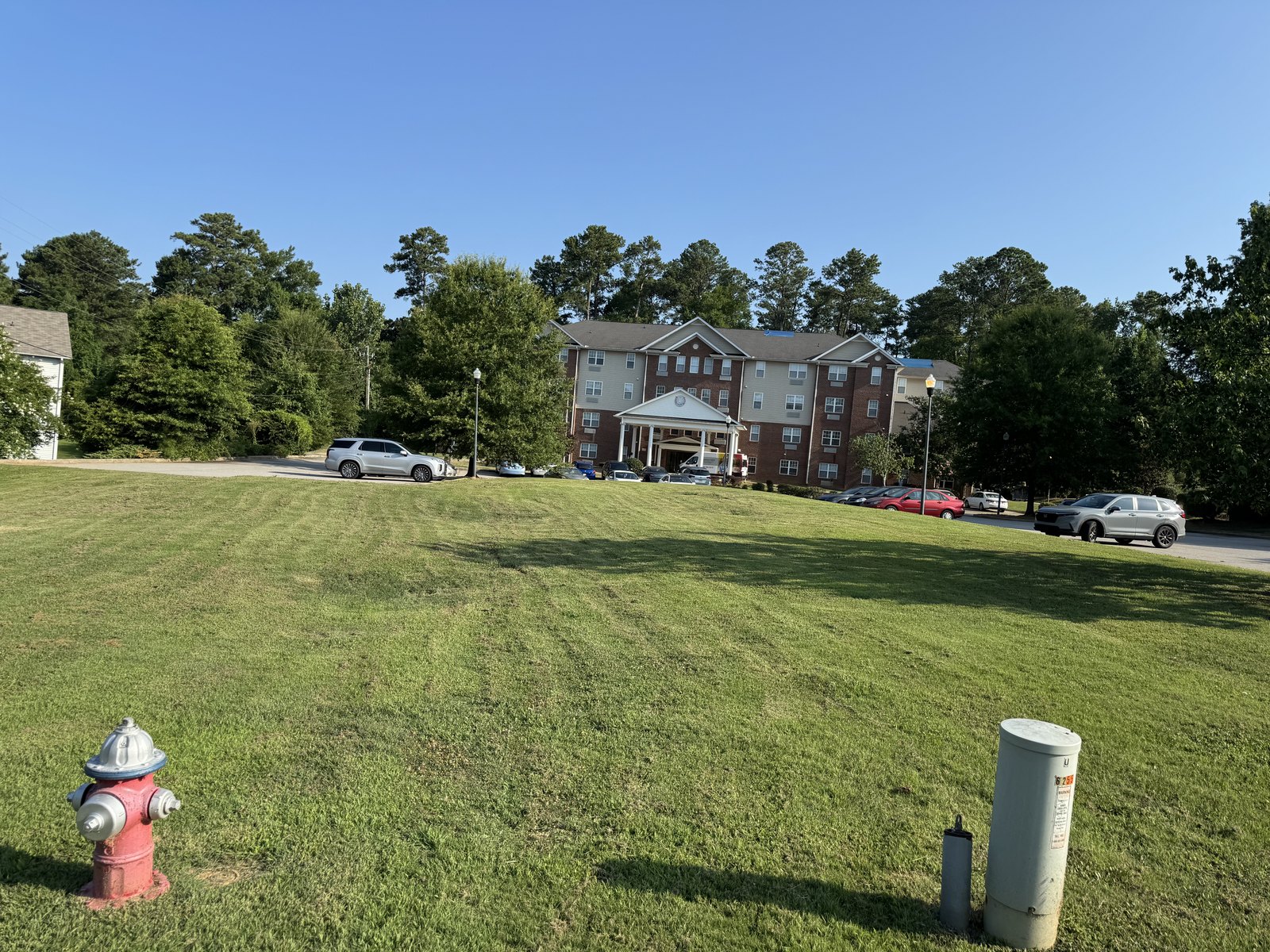 Maintained lawn in front of a multifamily apartment building