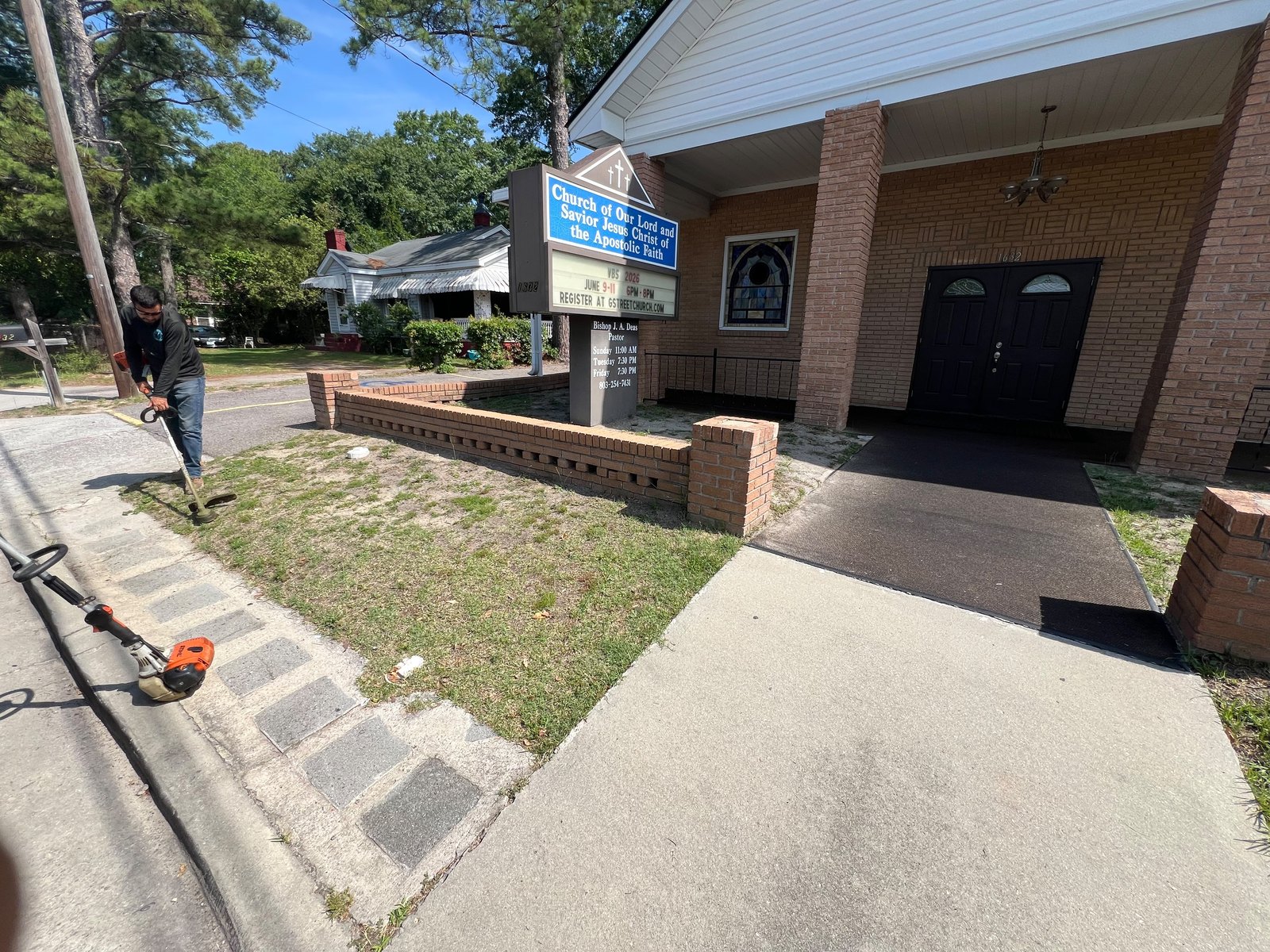 Exterior property maintenance underway at an organizational facility