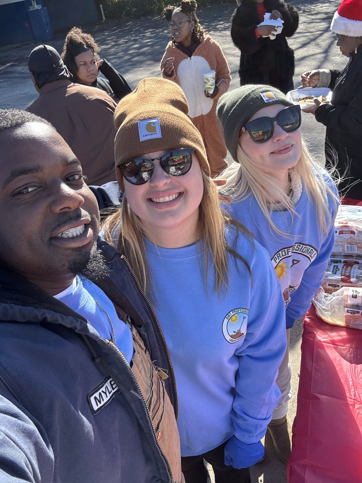 Dirt Professionals team members and community volunteers gathered at an outreach event