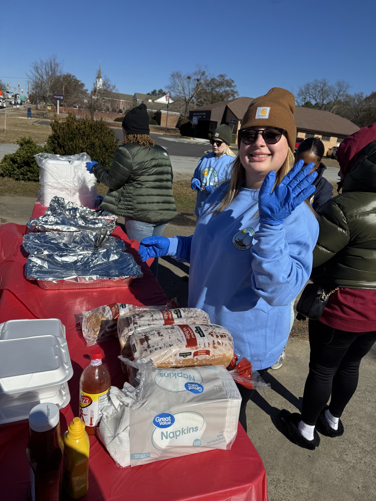 Community volunteer helping prepare food for distribution